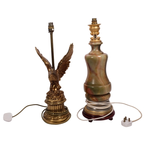 531 - A brass eagle figure table lamp, 52cm, and an Oriental turned onyx table lamp on separate stand