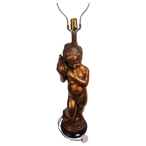 532 - A heavy composition table lamp, modelled as a gilded cherub holding a shell, height to top of head 6... 