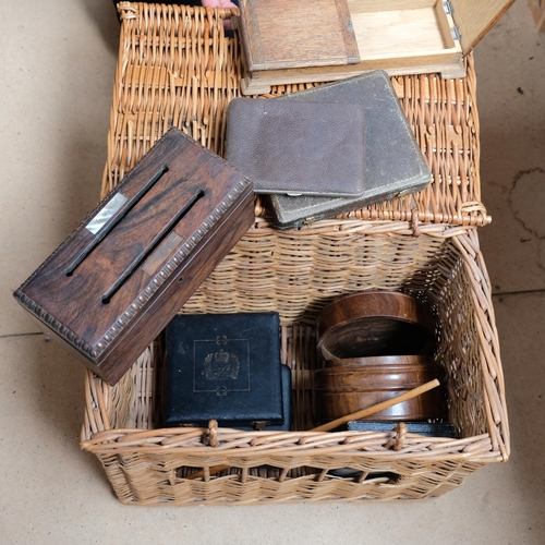 548 - A wicker hamper containing wooden boxes and empty cutlery boxes