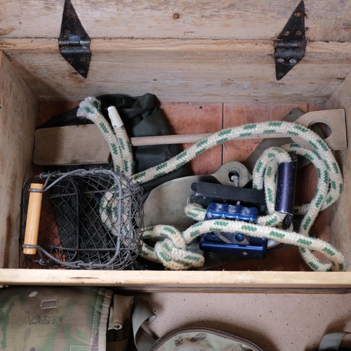 560 - A Vintage pine box, a brass propeller, wooden spade, and a camouflage rucksack kit