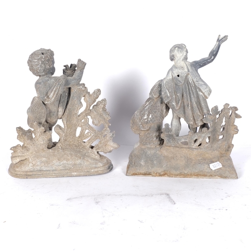 572 - 2 weathered cast-metal figural groups, 1 depicting a cherub, and another, H22cm