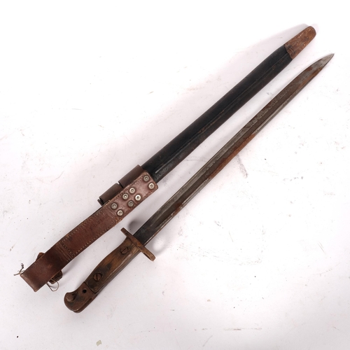 574 - An early 20th century bayonet with scabbard, L55cm