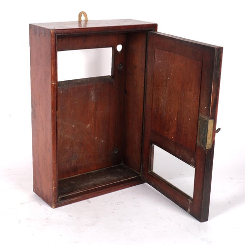 581 - A mahogany letter box mail catcher cabinet with glazed panel, H42cm