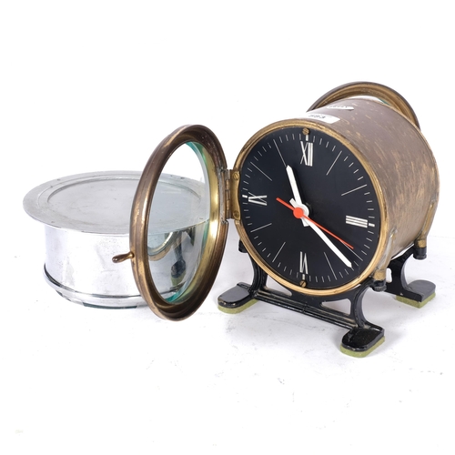 583 - A brass-cased clock on feet with quartz movement, and 2 dials, H20cm, and a chrome-cased bulkhead cl... 