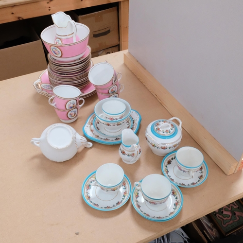 697 - A Victorian pink porcelain tea service, with painted floral cartouche, and a blue patterned Victoria... 