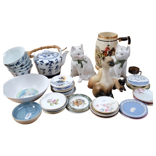 703 - A pair of Rye Pottery cats, 14cm, a collection of miniature plates, a Japanese tea kettle and cups e... 