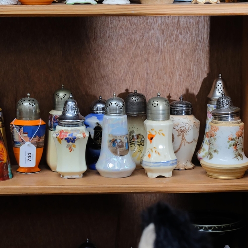 744 - A shelf of sugar casters, including Capodimonte, and Anita Harris conical example, tallest 2-2 Lord ... 