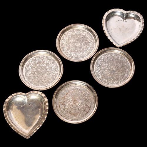 1001 - A pair of silver heart-shaped pin dishes, together with a set of 4 Persian white metal coasters