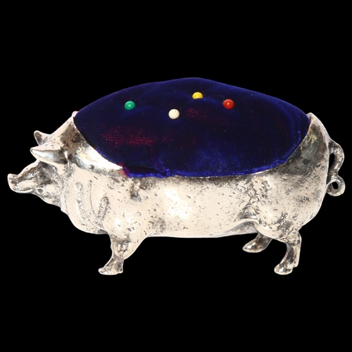 1002 - A large silver plated pig design pin cushion, L11cm