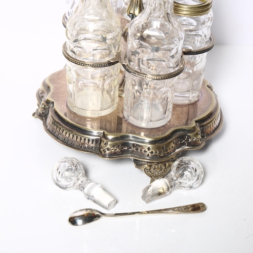 913 - A silver plated condiment stand, with 5 fitted bottles