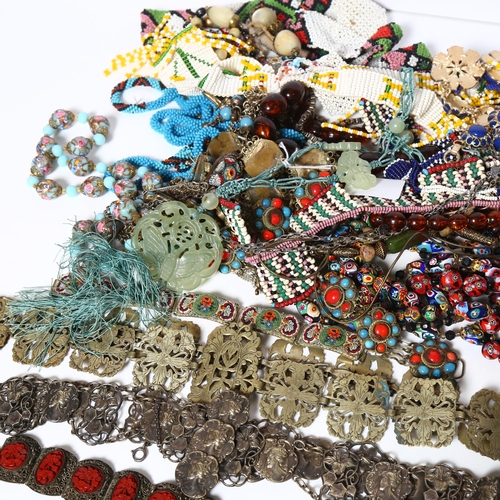 947 - A collection of costume jewellery, including painted glass bead necklaces, a turquoise and coral set... 