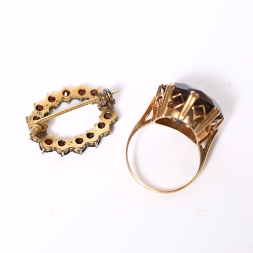 951 - An unmarked gold and citrine set dress ring, and a garnet and gilt-metal set brooch (2)