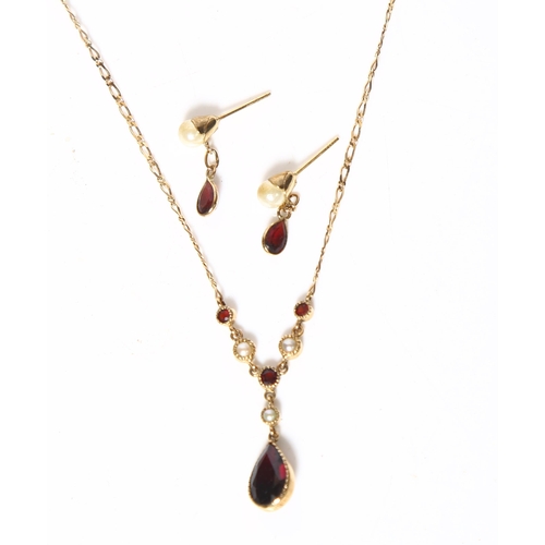 955 - A delicate 9ct gold seed pearl and red stone set drop pendant necklace and chain, together with a pa... 