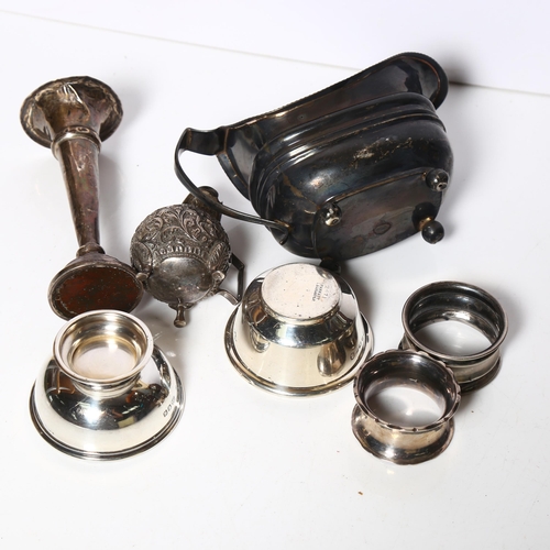 966 - A group of silver items, to include 2 napkin rings, a sauce boat, 2 small dishes, 4.2oz, a small sil... 