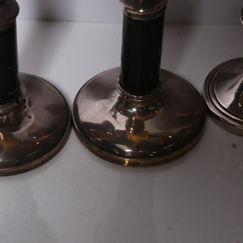 968 - A pair of squat silver candlesticks (filled base), H7cm, and a pair of silver and turned ebony candl... 