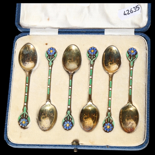 973 - A set of 6 George V silver-gilt and guilloche enamelled coffee spoons, in fitted case, hallmarks for... 