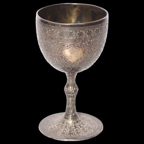 975 - An ornate Persian white metal goblet on turned foot, with allover engraved decoration, H11.5cm, 5.8o... 