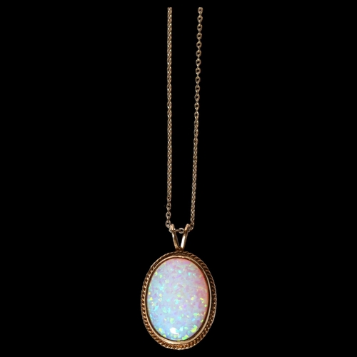 980 - A 9ct gold Gilson synthetic opal pendant necklace, in rope twist surround with 9ct fine cable link c... 