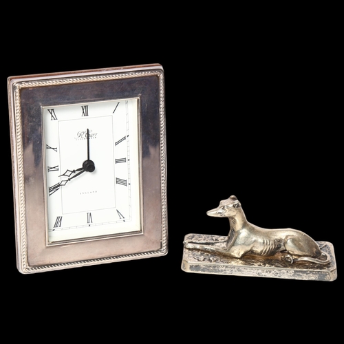 987 - R CARR - a silver-fronted quartz mantel clock, and a silver plated Greyhound design paperweight