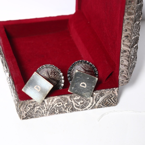 988 - An embossed white metal clad jewel box, matching photo frame, and a similar pair of plated peppers