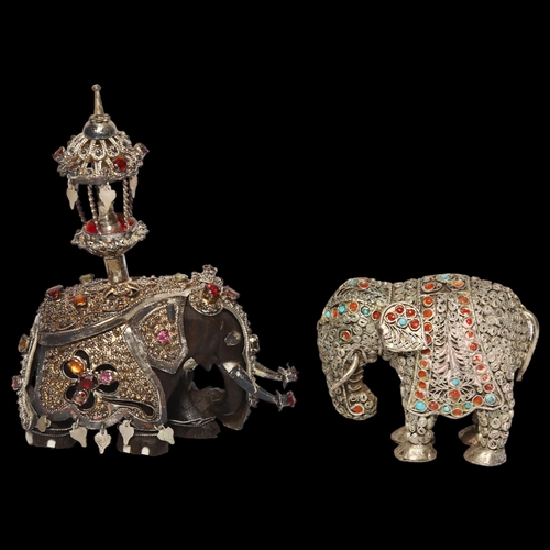 998 - An ornate Indian ebony and caparisoned elephant, H9.5cm, and a similar elephant (2)