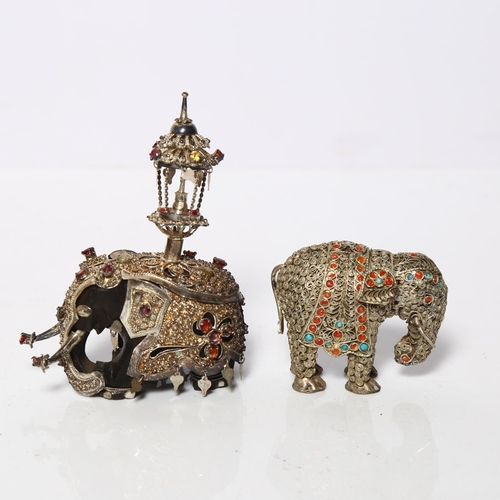 998 - An ornate Indian ebony and caparisoned elephant, H9.5cm, and a similar elephant (2)