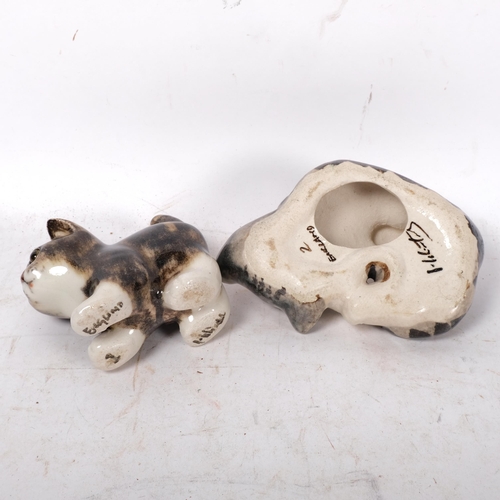 780 - A Winstanley kitten lying on its back, L16cm, and a smaller Winstanley kitten