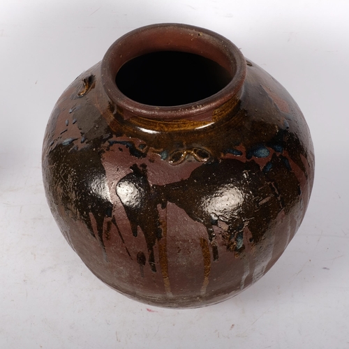 840 - A large Burmese clay pot with drip glaze decoration, H38cm