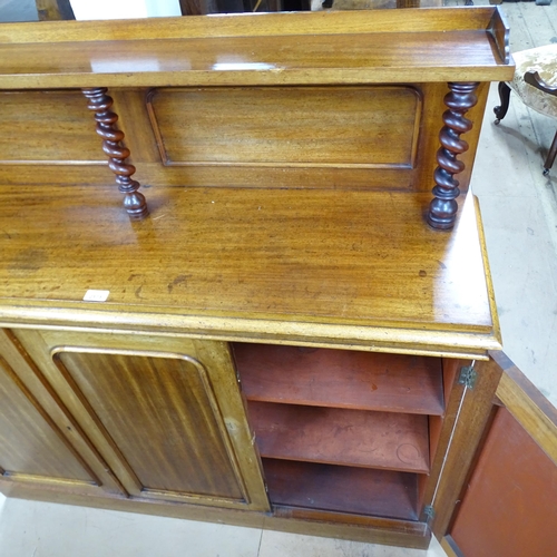 2171 - A Victorian mahogany chiffonier with 3 cupboard doors and raised back supported by three barley twis... 