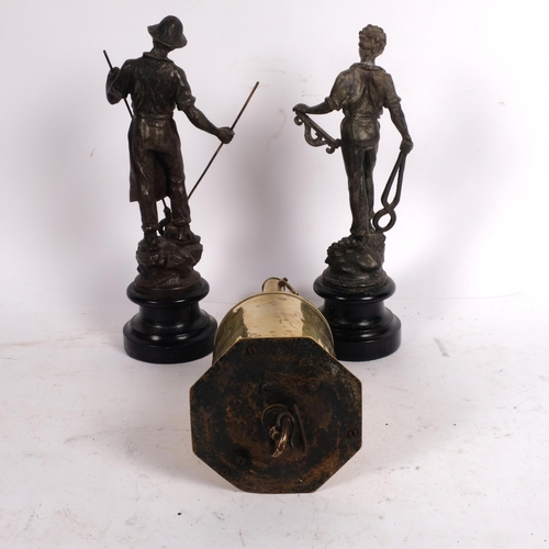 605 - A pair of French spelter metal workers, on wooden plinths, H28cm, and a brass spit-roasting jack