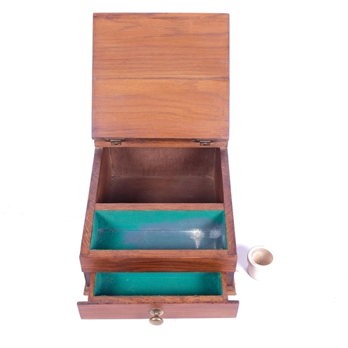 629 - A small oak table-top writing slope with inkwell and drawer under, W27.5cm