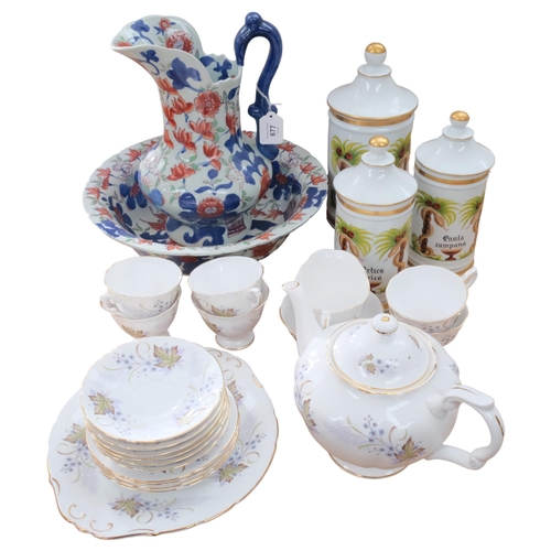 677 - Bone china tea service including teapot, a reproduction Imari style wash jug and basin, and a set of... 