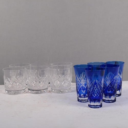 679 - A set of 6 cut-crystal Whisky tumblers, and a set of 5 blue overlay cut-glass beakers