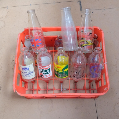 683 - 2 crates of 1980s advertising milk bottles, dairy bottles etc