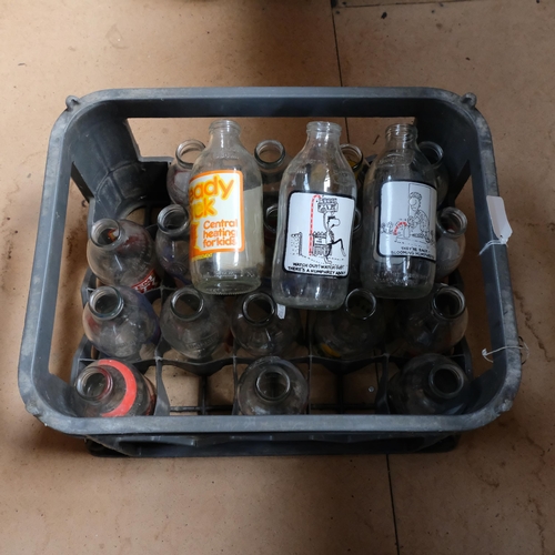 684 - A crate of 1980s advertising milk bottles, dairy bottles etc