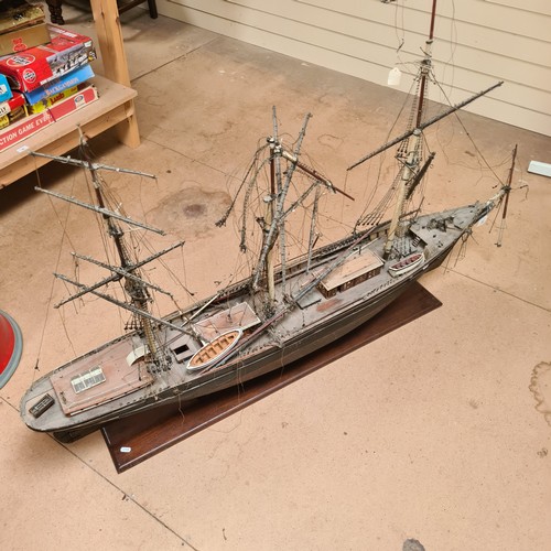 125 - A scratch-built riveted model of the Cutty Sark, with a box of associated accessories and spare part... 