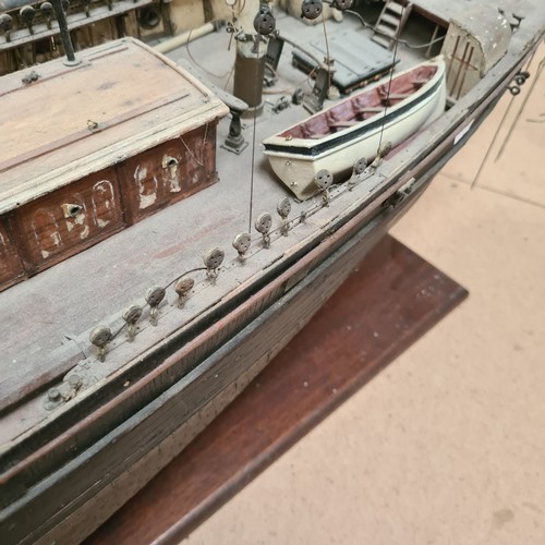 125 - A scratch-built riveted model of the Cutty Sark, with a box of associated accessories and spare part... 