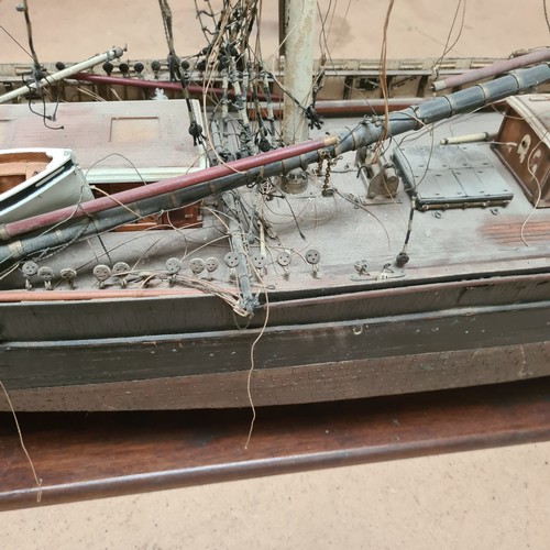 125 - A scratch-built riveted model of the Cutty Sark, with a box of associated accessories and spare part... 