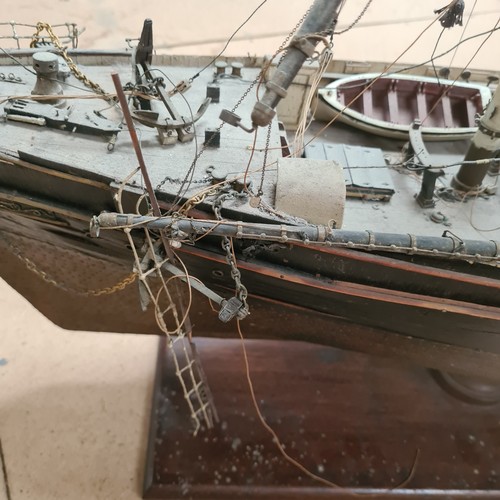 125 - A scratch-built riveted model of the Cutty Sark, with a box of associated accessories and spare part... 