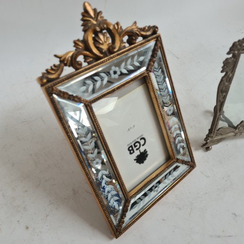 607 - A cast silver plated Art Nouveau style strut frame, H22cm, and a decorative modern mirrored frame