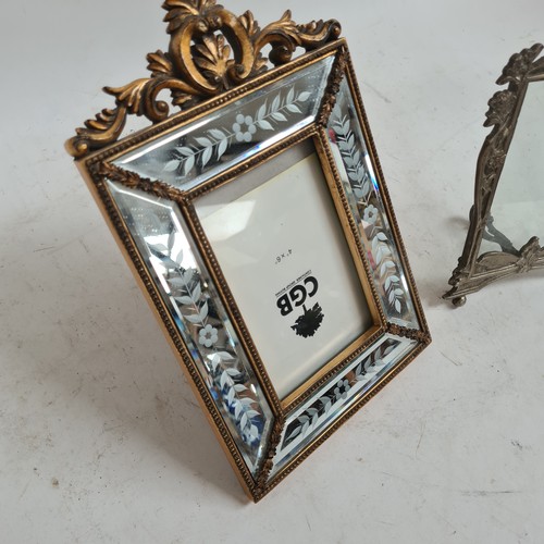 607 - A cast silver plated Art Nouveau style strut frame, H22cm, and a decorative modern mirrored frame