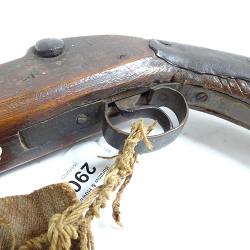 290 - An 18th century percussion pistol, engraved barrel and handle, not working, and a 19th century Middl... 