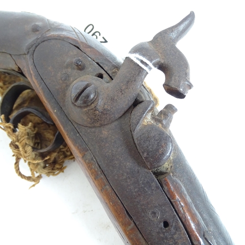 290 - An 18th century percussion pistol, engraved barrel and handle, not working, and a 19th century Middl... 