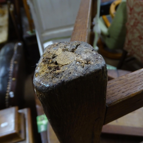 2051 - A 19th century oak circular topped cricket table with single frieze drawer. 75x62cm.