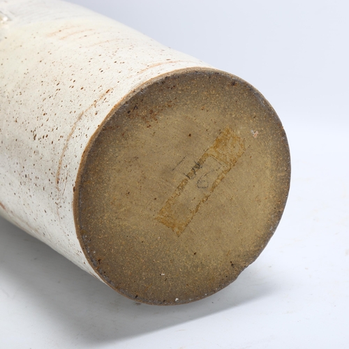 419 - A tall studio pottery vessel with Jun/ash glazes and lugs, marked with fish and JD to base, height 6... 