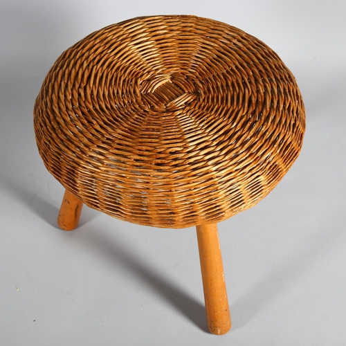 439 - A Tony Paul 1960s' wickers stool / ottoman on beech tripod frame, height 43cm, diameter 45cm