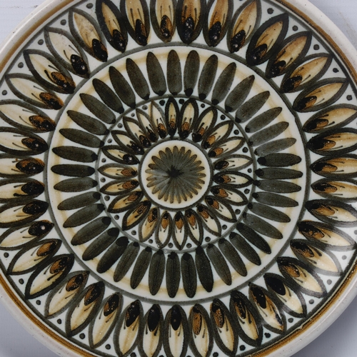 452 - A mid-century Rye pottery plate, impressed RYE and printed makers marks, diameter 22.5cm