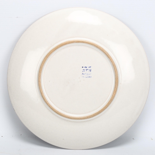 452 - A mid-century Rye pottery plate, impressed RYE and printed makers marks, diameter 22.5cm