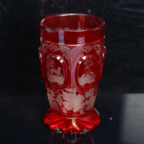 116 - 19th century Bohemian ruby flash glass beaker, with engraved animal design panels, 11cm