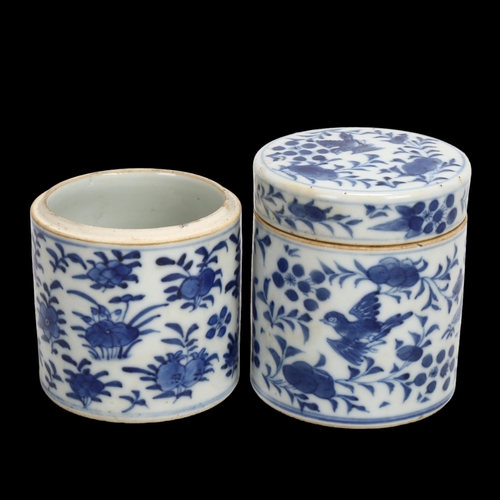 133 - A pair of Chinese blue and white porcelain cylindrical pots, with painted birds (1 lid missing), hei... 